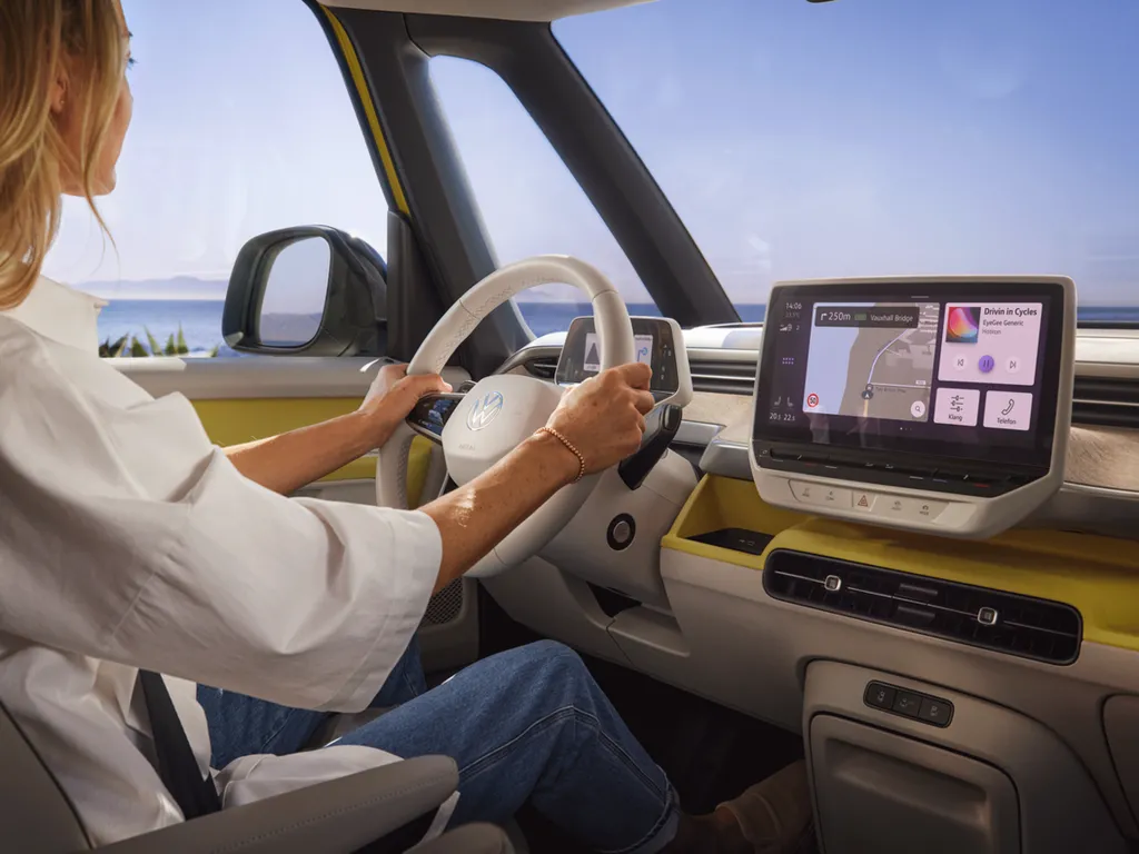 ib0178-id-buzz-interior-woman-sits-at-the-wheel.png